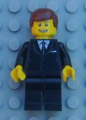 LEGO Minifigure-Suit Black, Reddish Brown Male Hair, Thin Grin with Teeth-Town / City-TRN142-Creative Brick Builders